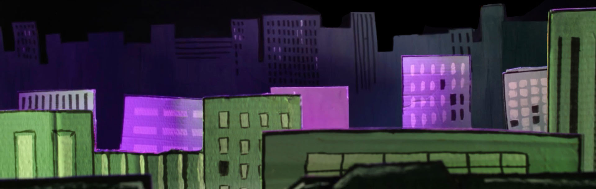 A Great View of A Large City in Purple and Green